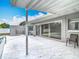 Covered patio with patterned concrete, sliding glass doors, and a view of the private pool and backyard at 2203 Beatrice Dr, Orlando, FL 32810