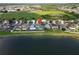 An aerial shot shows the neighborhood with a large lake nearby and beautiful views at 2332 Andrews Valley Dr, Kissimmee, FL 34758