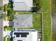 Aerial view of a home showcasing a well-maintained yard and roof at 2332 Andrews Valley Dr, Kissimmee, FL 34758
