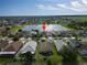 An aerial view of a neighborhood highlighting a beautiful lake view and Gathering friendly community at 2332 Andrews Valley Dr, Kissimmee, FL 34758