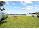 Fenced backyard with lake view and playset at 2332 Andrews Valley Dr, Kissimmee, FL 34758