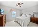 Inviting bedroom with a view of the lake, large bed, and classic wooden furniture at 2332 Andrews Valley Dr, Kissimmee, FL 34758