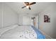 Bedroom featuring a ceiling fan, closet, and bedside mirror at 2332 Andrews Valley Dr, Kissimmee, FL 34758