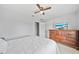Clean bedroom featuring neutral colors, ceiling fan, and TV on the dresser at 2332 Andrews Valley Dr, Kissimmee, FL 34758