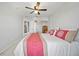 Bedroom featuring a ceiling fan, closet, and bedside mirror at 2332 Andrews Valley Dr, Kissimmee, FL 34758