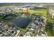 Aerial view of community near large pond, baseball and soccer fields at 2332 Andrews Valley Dr, Kissimmee, FL 34758