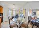 Cozy dining area with tile flooring, a modern light fixture, and sliding door access to the outdoors at 2332 Andrews Valley Dr, Kissimmee, FL 34758