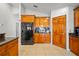 Kitchen area showcasing wooden cabinets, granite countertops, and stainless steel appliances at 2332 Andrews Valley Dr, Kissimmee, FL 34758