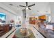 Open-concept living room with tile floors, vaulted ceilings, and seamless transition to the kitchen at 2332 Andrews Valley Dr, Kissimmee, FL 34758