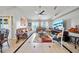 Spacious living room featuring tile floors, neutral colors, and large windows with natural light at 2332 Andrews Valley Dr, Kissimmee, FL 34758