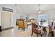 Open-concept living area featuring tiled flooring, front door, and furniture covered to protect at 2332 Andrews Valley Dr, Kissimmee, FL 34758