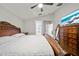 Bright main bedroom with neutral walls, ceiling fan, tv, and access to the main bath at 2332 Andrews Valley Dr, Kissimmee, FL 34758