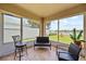 Sunroom offering views of fenced backyard with playset at 2332 Andrews Valley Dr, Kissimmee, FL 34758