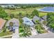 An aerial view showcases this home's new roof, mature trees and landscaping at 2391 Piedmont Lakes Blvd, Apopka, FL 32703