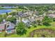 An expansive aerial view of the neighborhood including mature trees, community ponds, and lush landscaping at 2391 Piedmont Lakes Blvd, Apopka, FL 32703