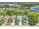 An aerial view of the neighborhood shows mature trees, community ponds and lush landscaping at 2391 Piedmont Lakes Blvd, Apopka, FL 32703
