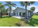 A backyard with a small shed, patio and palm trees at 2391 Piedmont Lakes Blvd, Apopka, FL 32703