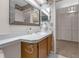 Bathroom with vanity, double sinks, and large mirror, designed for convenience and ample storage at 2391 Piedmont Lakes Blvd, Apopka, FL 32703