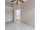 Bedroom with closet, a ceiling fan, and tiled floor offering a clean and comfortable living space at 2391 Piedmont Lakes Blvd, Apopka, FL 32703