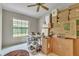 A room with a large window is being used to store boxes during a move at 2391 Piedmont Lakes Blvd, Apopka, FL 32703