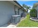 Exterior showing a generator and air conditioning unit installed outside of the home on a well-maintained lot at 2391 Piedmont Lakes Blvd, Apopka, FL 32703