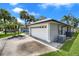 Two car garage on a single story home showing the air conditioner and duct work at 2391 Piedmont Lakes Blvd, Apopka, FL 32703