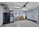 Spacious garage with ample storage shelving, refrigerator, and garage door opener at 2391 Piedmont Lakes Blvd, Apopka, FL 32703