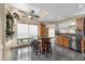 Eat-in kitchen area with breakfast bar, tile floors, and lots of light at 2391 Piedmont Lakes Blvd, Apopka, FL 32703