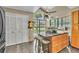 Kitchen island with storage, seating, and a large window providing natural light at 2391 Piedmont Lakes Blvd, Apopka, FL 32703