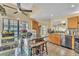 Open concept kitchen with a center island, stainless steel appliances, and tile floors at 2391 Piedmont Lakes Blvd, Apopka, FL 32703