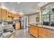 Functional kitchen featuring stainless steel appliances, tile backsplash, and center island at 2391 Piedmont Lakes Blvd, Apopka, FL 32703