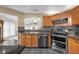 Kitchen area with stainless steel appliances, tile backsplash, and sink at 2391 Piedmont Lakes Blvd, Apopka, FL 32703