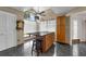 Kitchen area with a breakfast bar, tile floor, and large window at 2391 Piedmont Lakes Blvd, Apopka, FL 32703