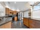 Kitchen featuring wooden cabinets, stainless steel appliances, and tile floors at 2391 Piedmont Lakes Blvd, Apopka, FL 32703