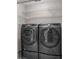 The laundry room features a modern Samsung washer and dryer set with upper storage shelves at 2391 Piedmont Lakes Blvd, Apopka, FL 32703