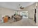 Bright living room featuring vaulted ceilings, a fan and neutral decor, creating a welcoming atmosphere at 2391 Piedmont Lakes Blvd, Apopka, FL 32703