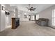 Spacious living room with fireplace, vaulted ceilings, ceiling fan, and access to other rooms in the home at 2391 Piedmont Lakes Blvd, Apopka, FL 32703