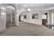 Open-concept living room featuring tile entryway, carpet, and lots of natural light at 2391 Piedmont Lakes Blvd, Apopka, FL 32703