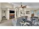 Open-concept living room with a fireplace, seamlessly connecting to other living spaces, great for entertaining at 2391 Piedmont Lakes Blvd, Apopka, FL 32703