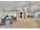 Spacious living room featuring a fireplace, ceiling fan and a large mirror at 2391 Piedmont Lakes Blvd, Apopka, FL 32703