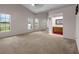 Spacious main bedroom with carpet, large windows, and an attached bathroom at 2391 Piedmont Lakes Blvd, Apopka, FL 32703