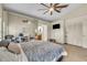 Spacious main bedroom featuring a ceiling fan, large windows, and a mirrored closet at 2391 Piedmont Lakes Blvd, Apopka, FL 32703