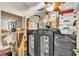 Messy storage area with boxes, speakers, and various household items at 2391 Piedmont Lakes Blvd, Apopka, FL 32703