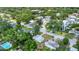 Aerial view of a lush, green neighborhood showcasing various home styles and mature trees, offering a serene environment at 2525 Lafayette Ave, Winter Park, FL 32789