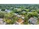 Aerial view of a residential neighborhood showcasing lush trees and various rooftops at 2525 Lafayette Ave, Winter Park, FL 32789