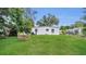 Spacious backyard featuring a lush lawn and a cozy seating area, perfect for outdoor enjoyment at 2525 Lafayette Ave, Winter Park, FL 32789