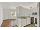Functional kitchen design offering white cabinetry, neutral countertops, and ample natural light at 2525 Lafayette Ave, Winter Park, FL 32789