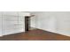 Inviting living space showcasing beautiful wood floors, white walls, and convenient built-in storage at 2525 Lafayette Ave, Winter Park, FL 32789