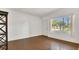 Bright living room with beautiful wood floors, a large window, and ample natural light at 2525 Lafayette Ave, Winter Park, FL 32789
