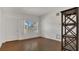 Cozy living room featuring hardwood floors, bright walls, and a large window at 2525 Lafayette Ave, Winter Park, FL 32789